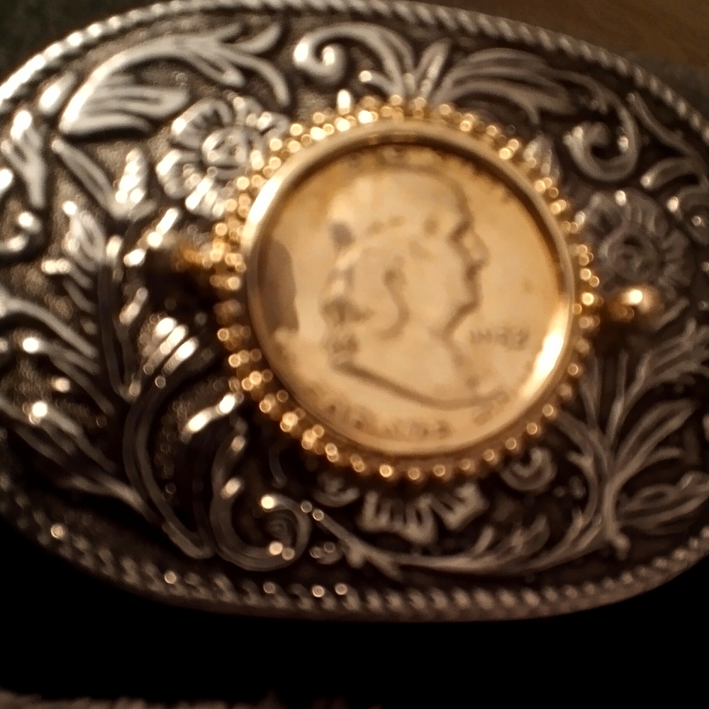 Mens silver belt buckle with a Benjamin Franklin half dollar in the center 1952